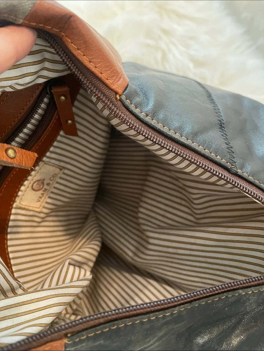 Black Leather Backpack with Brown Trim and Brass Accents